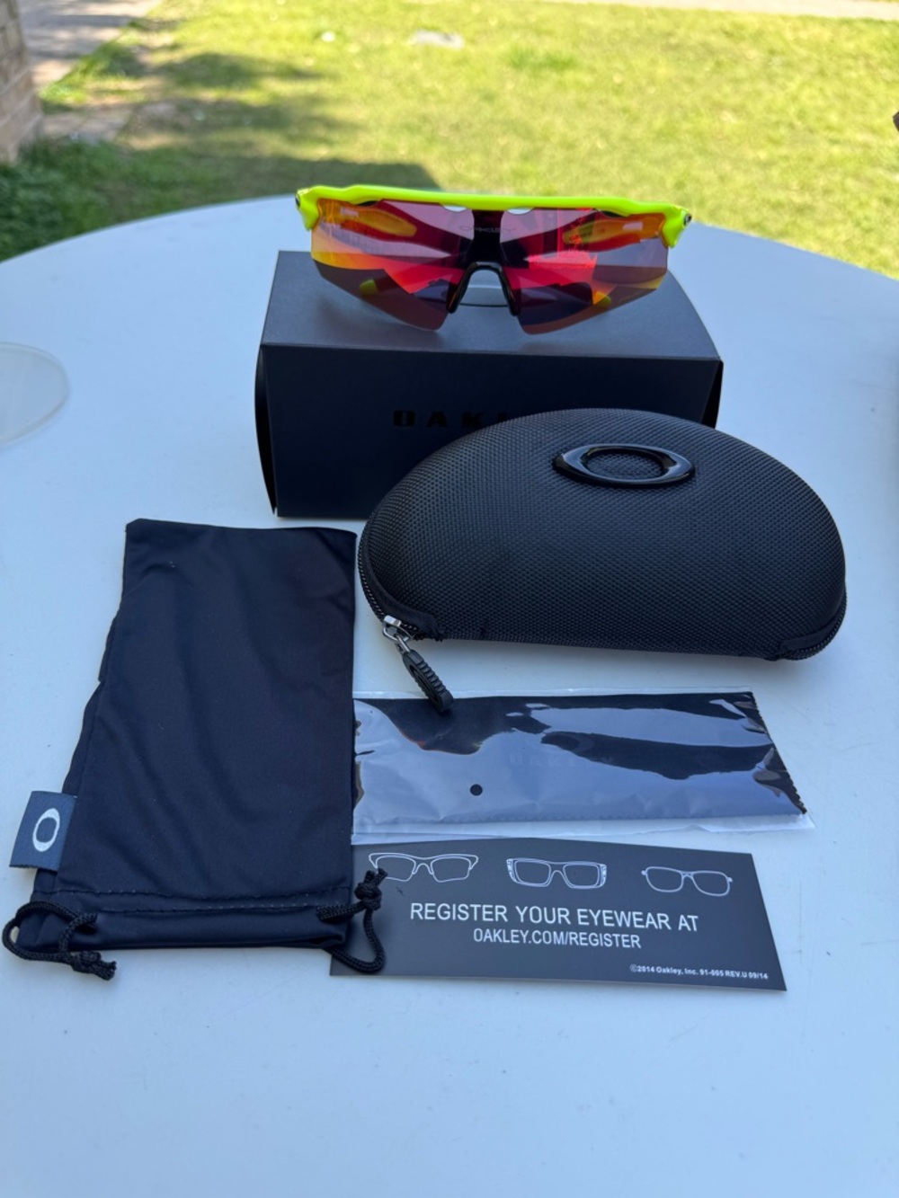 Oakley Neon Yellow Frame Sunglasses with Red Mirrored Lenses